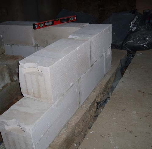 Image of first blocks laid for new walls in the cellar
